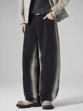 Men’s plus size black wide-leg denim jeans with faded distressed wash and subtle gray gradient fading down the legs