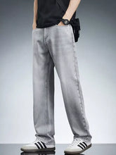 Men’s plus size washed wide leg jeans in light gray denim featuring classic stitching and a faded wash design
