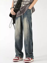 Men’s plus size washed wide leg jeans in faded denim with distressed wash and subtle vertical seam detailing