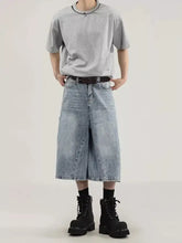 Men’s plus size wide leg capris jeans in light wash denim with a relaxed fit and frayed hems