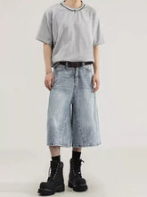 Men’s plus size wide leg capris jeans in light-wash denim with relaxed wide-leg cut and subtle fading