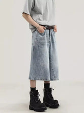Men’s plus size wide leg capris jeans in light-wash denim with a relaxed fit and slightly distressed look