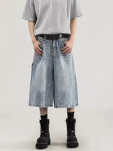 Men’s plus size wide leg capris jeans in light-wash denim with a relaxed fit and visible stitching details
