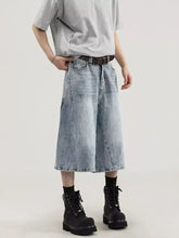 Men’s plus size wide leg capris jeans in light-wash denim with a relaxed fit and visible stitching details