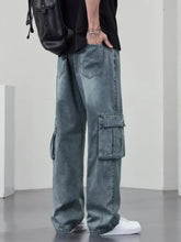 Men’s plus size wide leg cargo jeans in washed blue denim with loose fit and large side pockets design