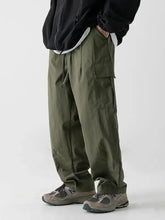 Mens plus size wide leg cargo pants in olive green with drawstring waist