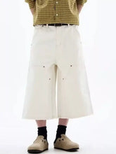 Mens plus size wide-leg cropped jeans in cream-colored denim with relaxed utilitarian design and visible stitching details