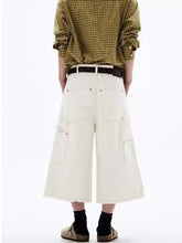 Men’s plus size wide-leg cropped jeans in cream color with cargo pockets and frayed hem detail