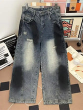 Men’s plus size wide leg distressed jeans in faded blue denim with high waist and subtle thigh embroidery