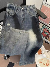 Men’s plus size wide leg distressed jeans featuring dark-wash denim with a high waist and distressed patches