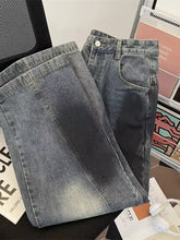 A pair of men’s plus size wide leg distressed jeans in dark-wash denim with faded and visible stitching details