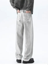Men’s plus size wide leg high waisted jeans in light gray faded denim with classic back pockets shown from the back side