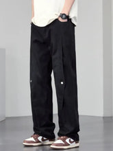 Men’s plus size black wide leg jeans with white button accents on the sides designed as cargo pants