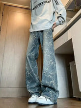 Men’s plus size wide leg denim jeans in blue with faded distressed look and white floral patterns