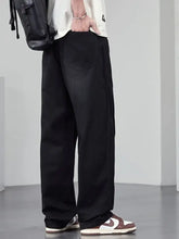 Men’s plus size black wide leg jeans with a relaxed fit and subtle stitching details in denim material