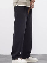 Men’s plus size wide leg black denim jeans with relaxed fit and visible stitching along the seams