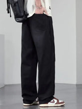 Men’s plus size black wide leg jeans featuring relaxed fit denim with subtle stitching details