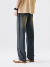 Men’s plus size wide leg dark-wash denim jeans with a faded gradient effect transitioning to olive green at the hem