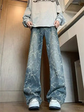 Men’s plus size wide leg jeans in faded blue denim with white snowflake patterns featuring wide leg design