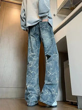 Men’s plus size wide leg jeans in faded blue denim with a white floral pattern and relaxed wide leg fit