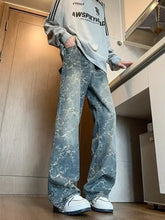 Men’s plus size wide leg jeans in light-wash denim with bold abstract white pattern and wide leg cut