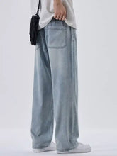 Men’s plus size light-wash denim wide leg jeans with relaxed fit and visible stitching details