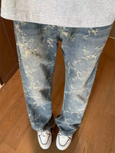 Men’s plus size wide leg jeans in light-wash denim with a subtle abstract white pattern and wide leg cut