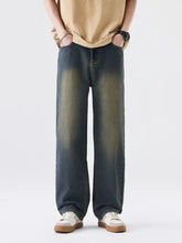 Men’s plus size wide leg jeans in dark-wash denim with a faded distressed look and wide-leg cut