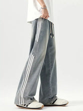 Men’s plus size light-wash denim wide leg jeans with three bold white side stripes down each leg