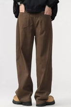 Brown men’s plus size wide leg trousers made of soft textured fabric with classic back pockets and relaxed fit back view