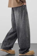 Men’s plus size wide leg wash jeans in dark gray denim with faded wash and visible stitching