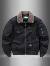 Men plus size black shearling-lined bomber jacket with gold zipper accents and small brand patch on chest