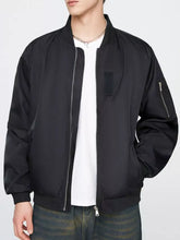 Men’s plus size black bomber jacket with matte finish silver zippers and subtle left chest patch lightweight design