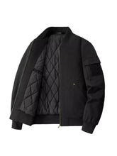Men plus size black quilted bomber jacket with diamond-patterned lining and tactical patch on the sleeve