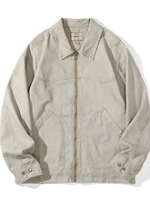 Beige plus size canvas trucker jacket with classic collar, front zipper, and two large patch pockets for men
