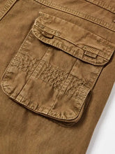 Brown mens pocketed pants with prominent side cargo pocket