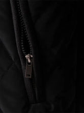 Men’s black quilted snap long sleeve jacket featuring a silver-toned zipper pull tab detail