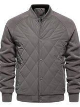 Men’s gray quilted snap long sleeve jacket with diamond-stitched pattern and ribbed cuffs for casual wear