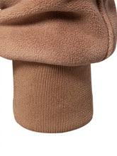 Tan fleece-lined cuff with ribbed knit wristband on men’s quilted snap long sleeve jacket for added warmth and comfort