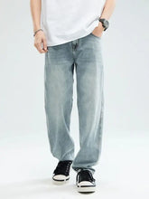 Men’s relaxed fit jeans in light-wash denim with a relaxed fit and subtle fading for a casual modern look