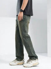 Men’s relaxed fit jeans in dark green denim with a slightly faded look and straight-leg cut for comfortable fit jeans