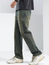 Men’s relaxed fit jeans in dark green faded denim with classic stitching and relaxed fit design