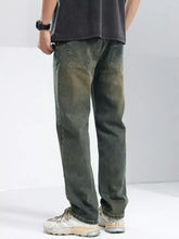 Dark green relaxed fit jeans in denim with a classic five-pocket design for men’s casual wear