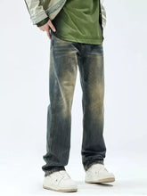 Men’s relaxed fit jeans in dark-wash denim with a faded, distressed look and rolled cuffs for casual wear