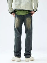 Men’s relaxed fit dark-wash denim jeans with a faded distressed look and frayed hem for casual wear