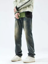 Men’s relaxed fit jeans in distressed dark-wash denim with faded patches and frayed cuffs for casual wear
