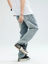 Men’s relaxed fit jeans in light-wash denim with a relaxed fit and subtle whiskering details in fabric blend