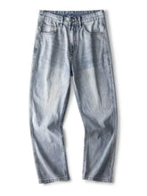 Men’s relaxed fit jeans in light-wash denim with a fabric blend and classic five-pocket design for casual wear