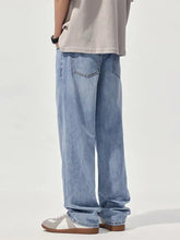 Men’s light-wash denim jeans with a relaxed fit straight leg cut for comfortable casual wear