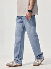 Men’s relaxed fit straight leg jeans in light-wash denim with a relaxed fit straight cut for casual wear